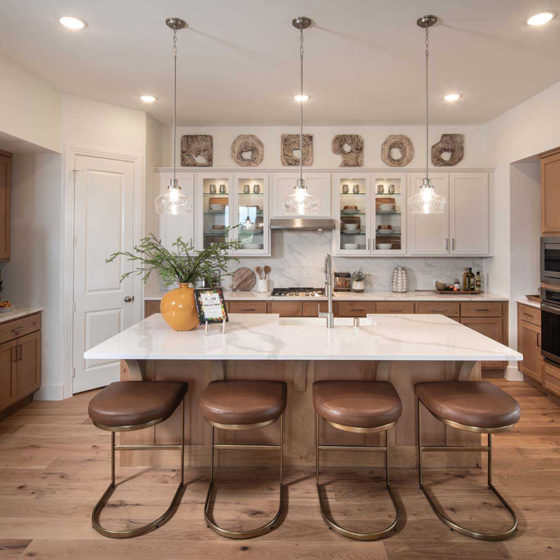 A farmhouse inspired kitchen with a large central island at VIDA