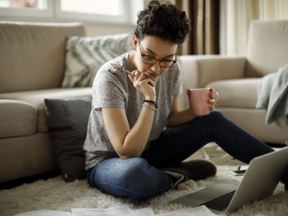 Young woman working at home using high speed internet at VIDA San Antonio