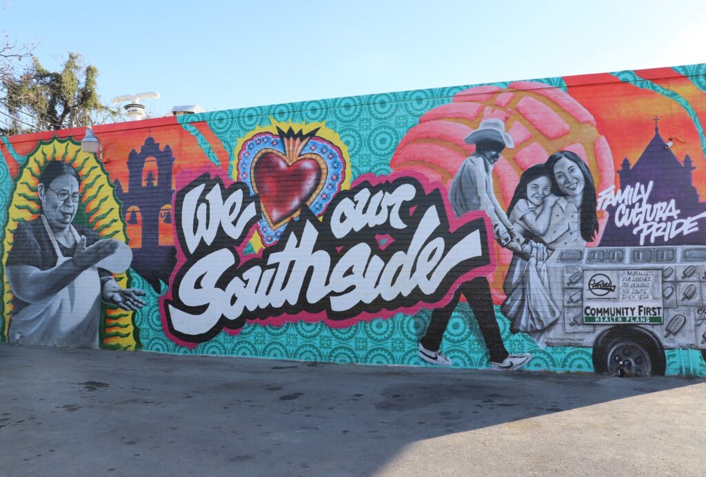 A colorful mural featuring family, cultura, and pride of Southside San Antonio