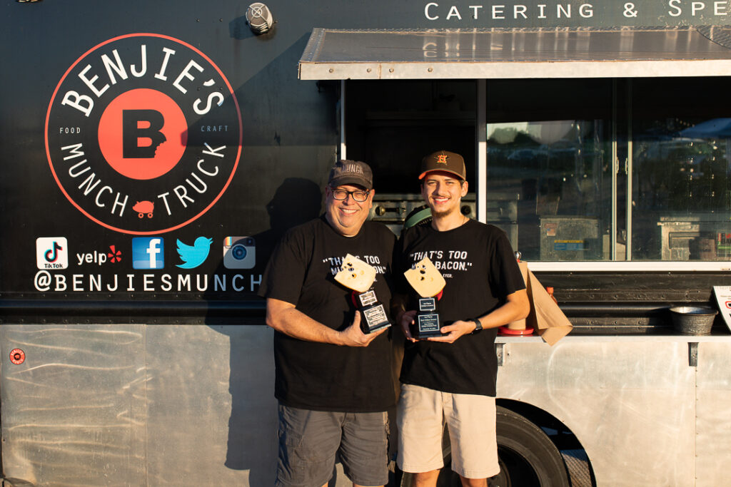Benjie's Munch owners in front of food truck
