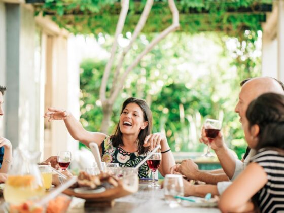 Townhome owners enjoying their new outdoor living area with dinner, drinks and company