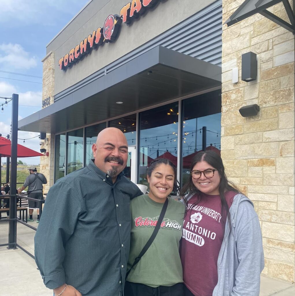 Smiley Orozco smiles and poses with family in San Antonio.