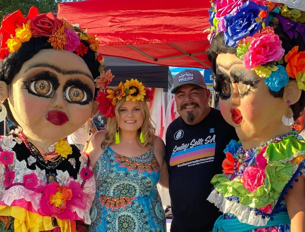 Realtor Smile Orozco stands amongst friends at a fiesta in San Antonio