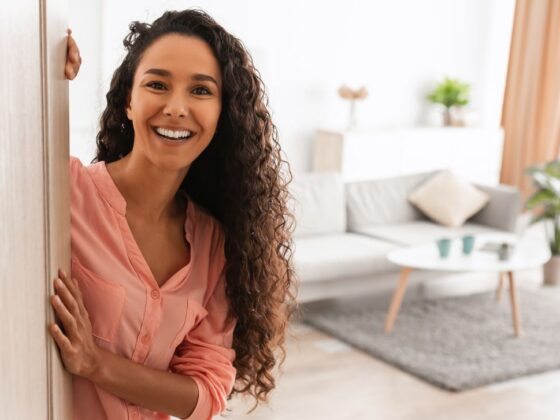 Young Woman Opens the Front Door to her bright, new, modern townhome at VIDA San Antonio
