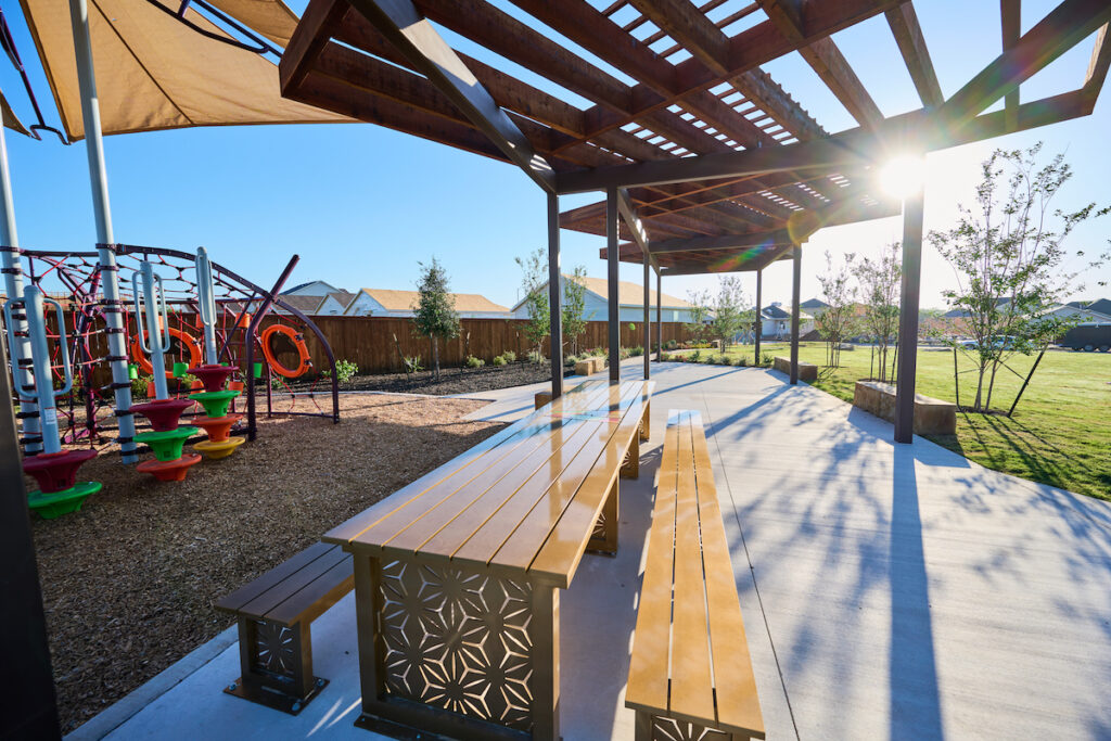 The sun rays shine through the pavilion at Ana Park on the Southside at VIDA San Antonio.