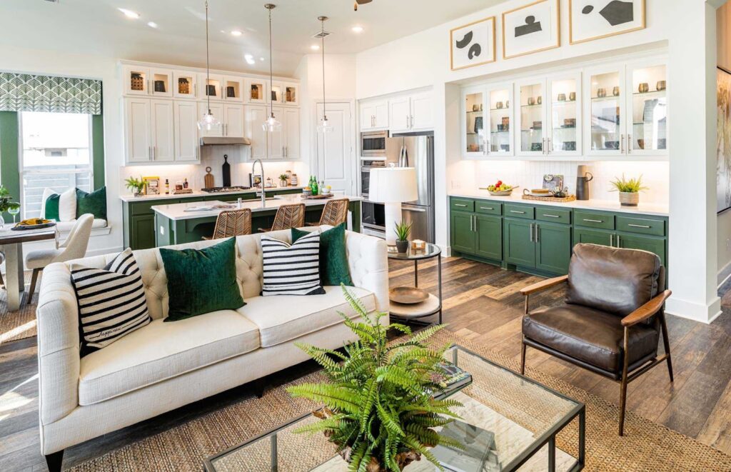 A stylish living room with green accents in a newly constructed home at VIDA San Antonio.