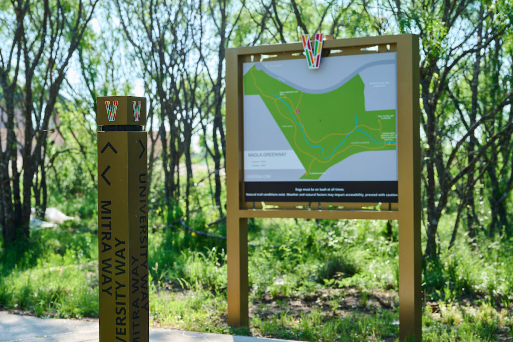 The trailhead and map signs at the beginning of the Madla Greenway in San Antonio.