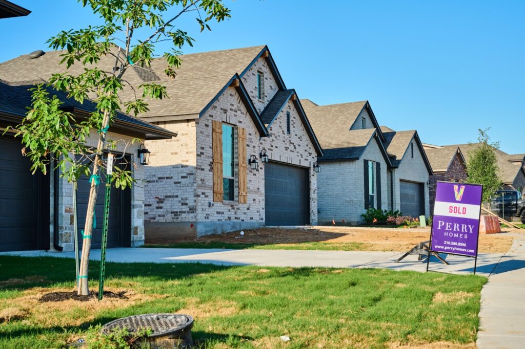 A sold sign in front of a new construction home on the southside of San Antonio.