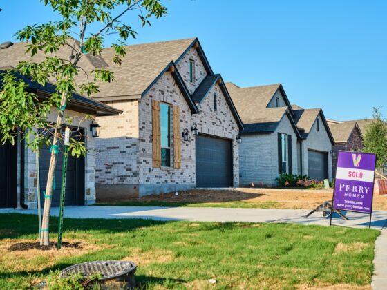 A sold sign in front of a new construction home on the southside of San Antonio.