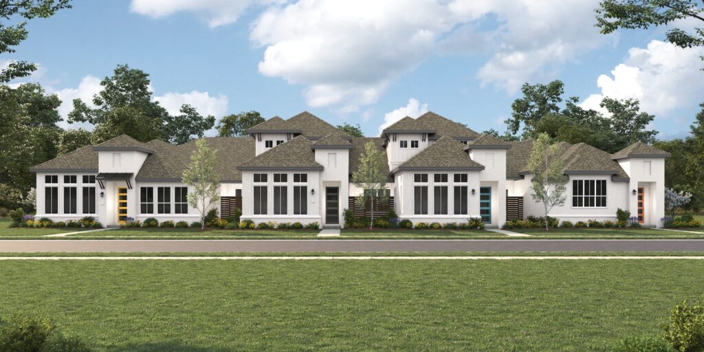 A line of new, contemporary townhomes painted white against a blue sky at VIDA San Antonio