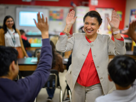 Roxie Freeman high fives students