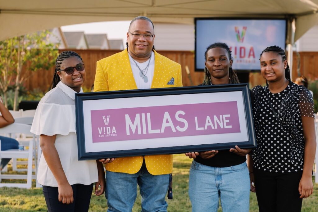 Chef Milas holding a design of his street name dedication at VIDA San Antonio