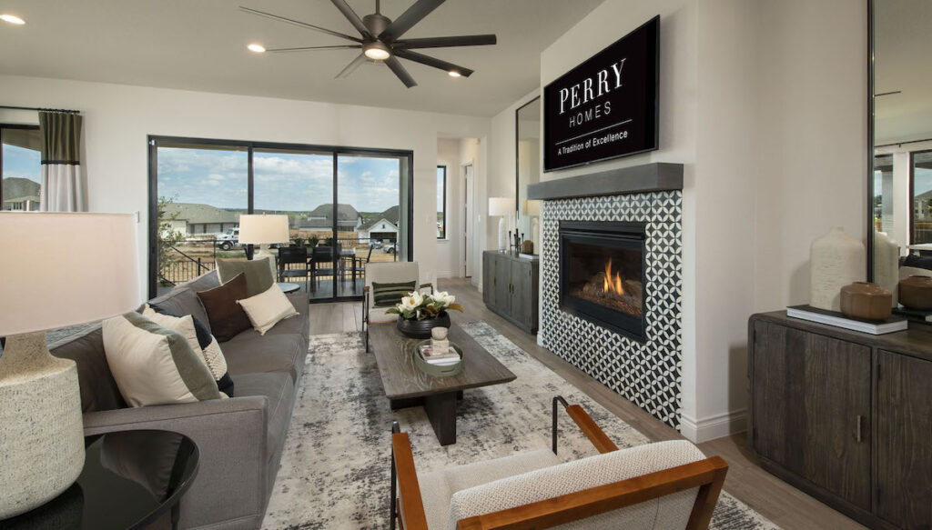 Perry Home living room with collapsible patio doors for entertaining.