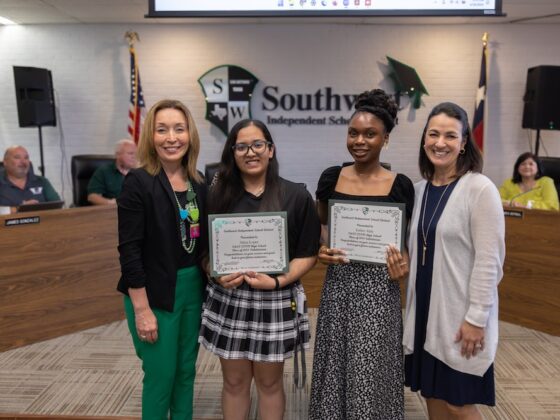 Jeanette Ball, Superintendent of Southwest ISD stands with students to celebrate student achievements