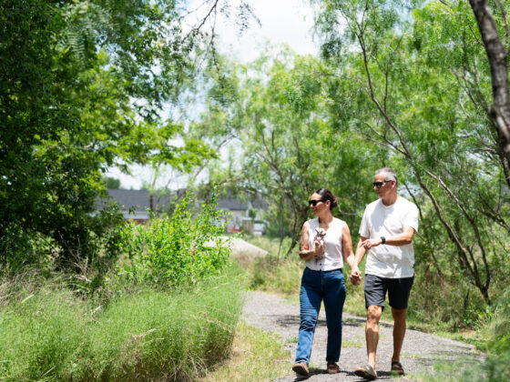 A couple walks on the Madla Greenway