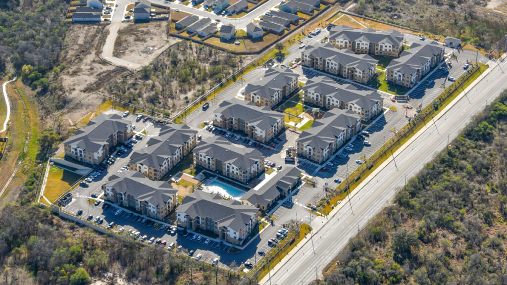 A holistic view of the completed Los Arcos Apartment community from a sky high view.