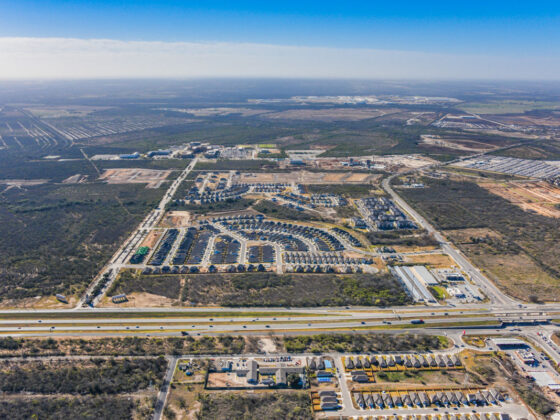 A sweeping aerial view of the fastest growing community in south san antonio, texas a&m to the south, university health hospital campus across the street.