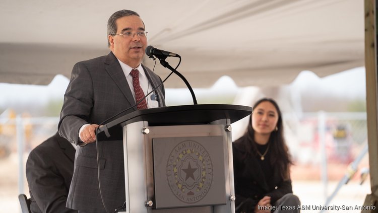 Texas A&M University-San Antonio President Hector Ochoa stands at a podium.