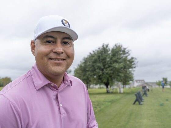 Ray Garza dressed in a pink golf shirt at Mission del Lago golf course