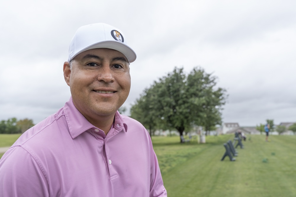 Ray Garza dressed in a pink golf shirt at Mission del Lago golf course