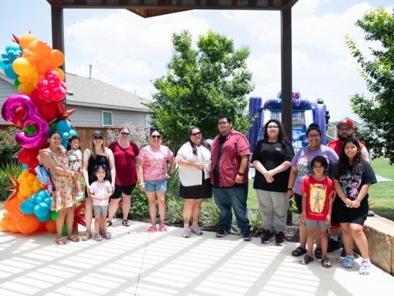 VIDA San Antonio residents gather at Ana Park for a group photo