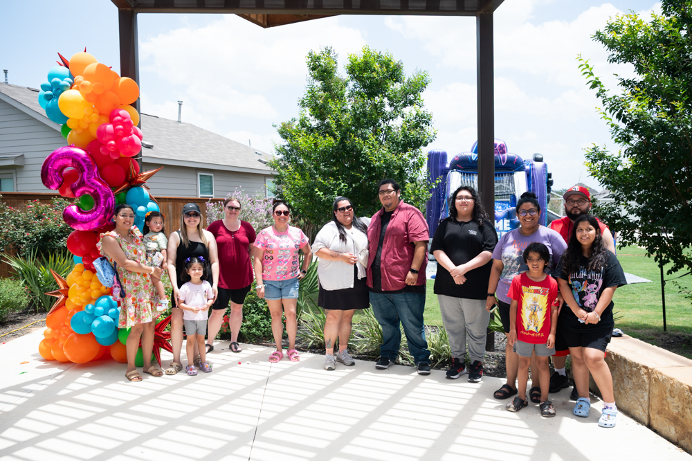 VIDA San Antonio residents gather at Ana Park for a group photo