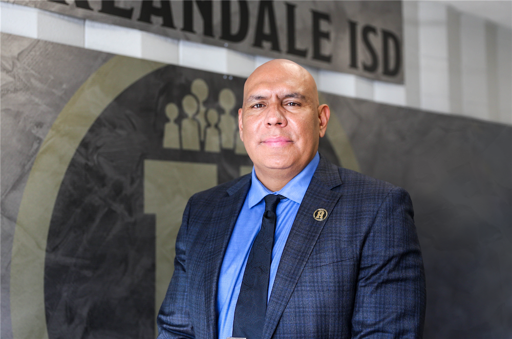 Harlandale Independent School District Superintendent, Geradro Soto poses for a portrait with Harlandale ISD in the background