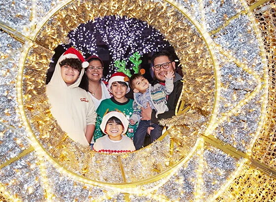 a family enjoys winter lights