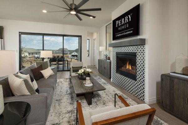 Perry Home living room with collapsible patio doors for entertaining.