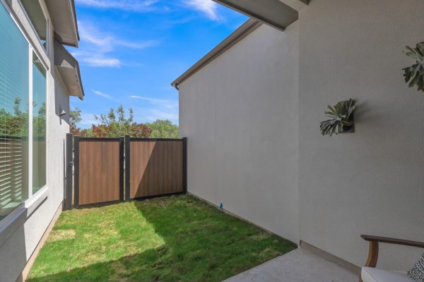 Townhome backyard with grass and fence