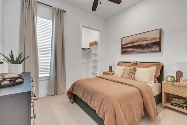 Modern bedroom of a townhome with white walls