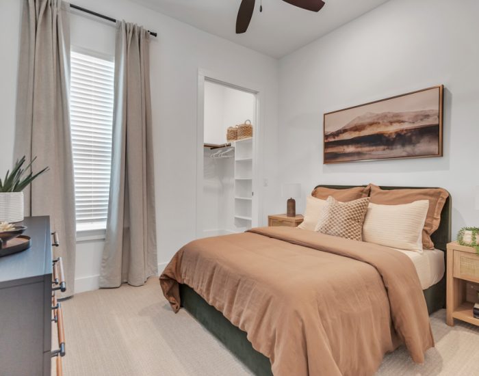 Modern bedroom of a townhome with white walls