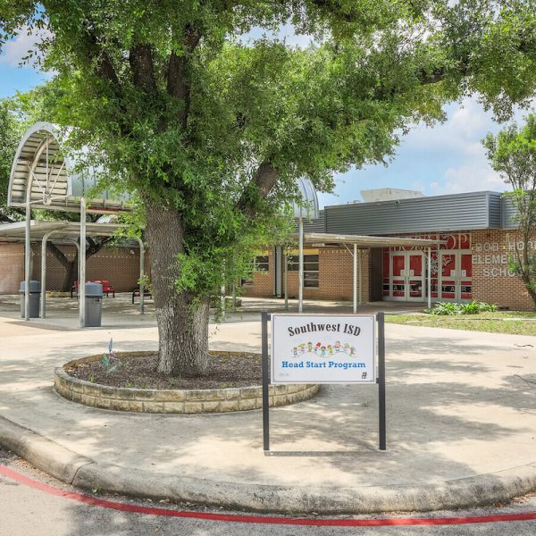 Bob Hope Elementary School entrance with a large green tree in the front.